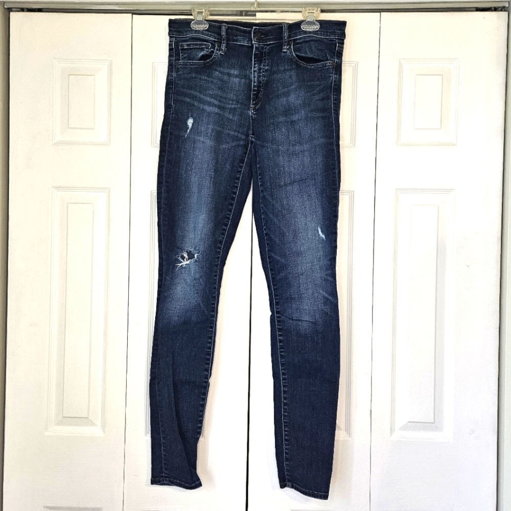 Medium Blue Skinny Jeans with Distressing and Tapered Leg